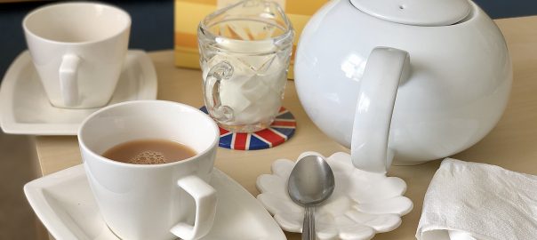 Tea cup, milk jug and tea pot